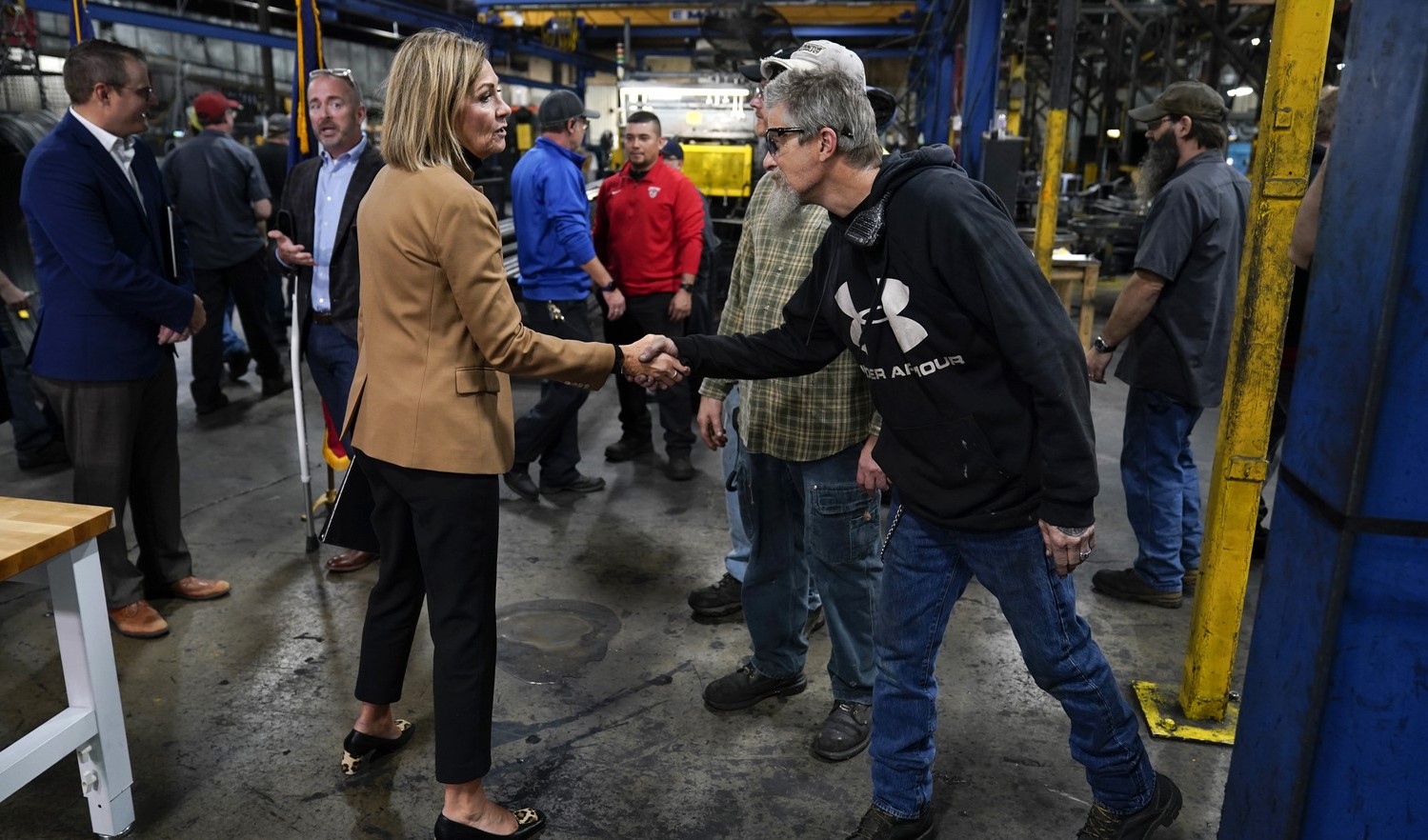 a man and a woman is shaking hand which means recovery of labour force